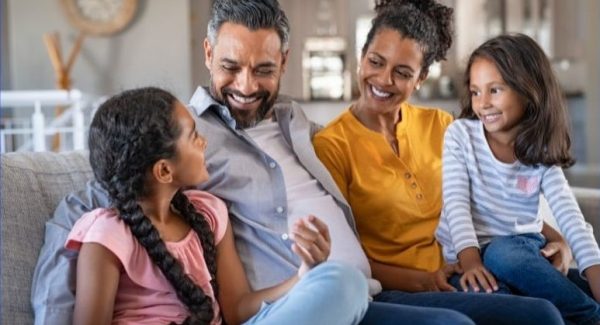family sitting on couch